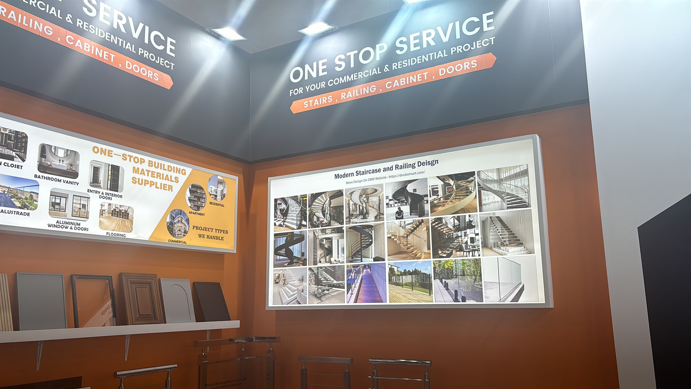The product-range board on the Double Building Materials stand at BAU 2025, showing staircases, balustrades, cabinets, vanities, doors and flooring