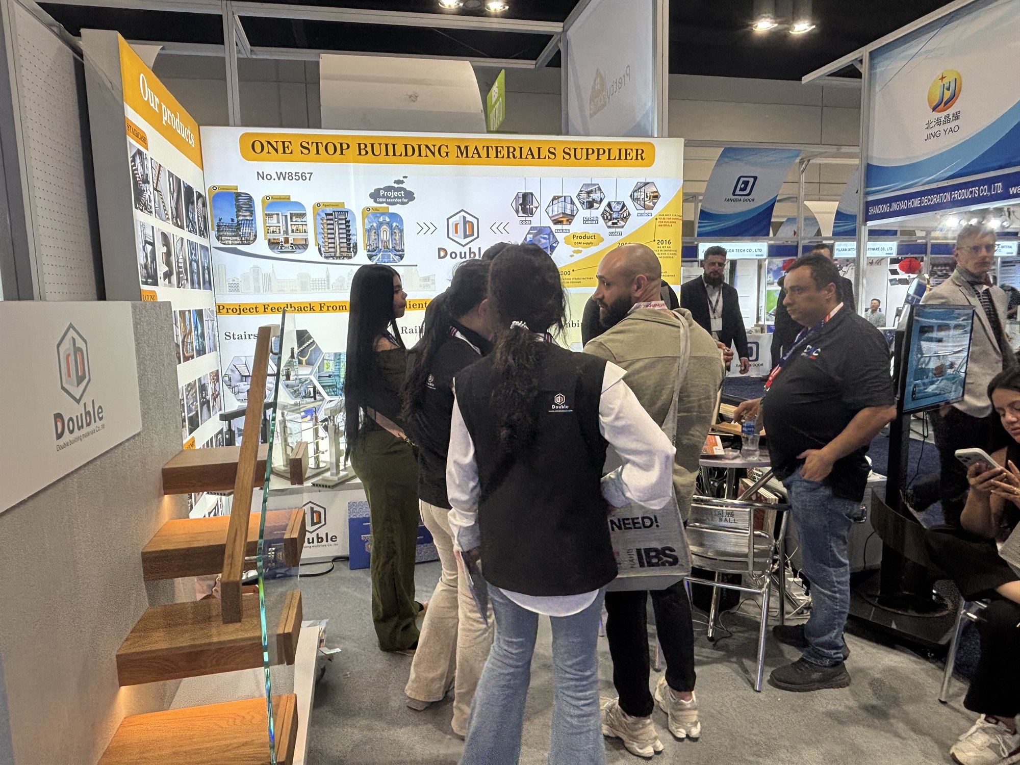A group of US builders and contractors gathered at the Double Building Materials booth during the IBS 2026 trade show